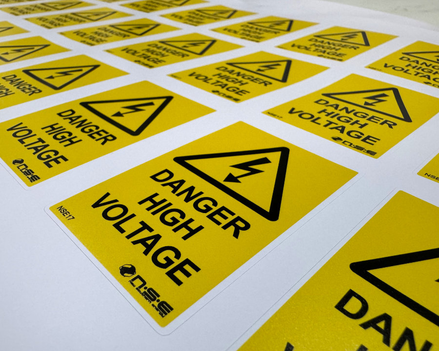 Sheet of yellow Danger High Voltage warning label stickers